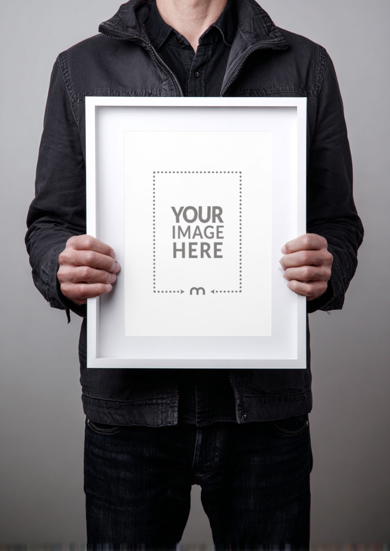 Frame Mockup Held by Creative Director for Visual Portfolio Showcase preview image