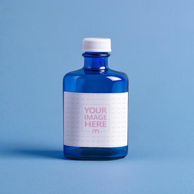 Paper Label Mockup on Blue Ink Bottle for School Supply Marketing