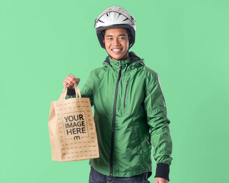 Craft Paper Bag Mockup Held by Delivery Person preview image