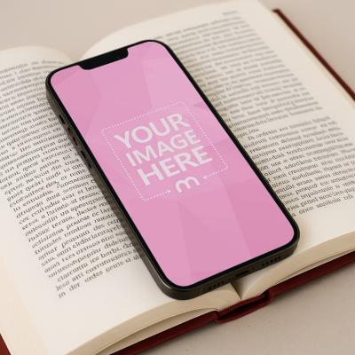 iPhone Mockup Between Open Book for Creative Displays
