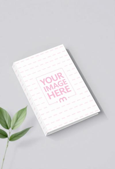 Book Mockup Flatlay with Leaf on Gray Background