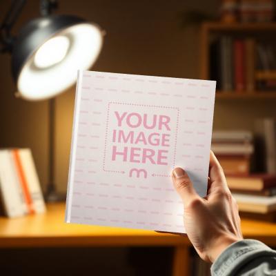 Book Cover Mockup Held over Cozy Table Background