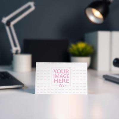 Business Card on White Table with Reading Table Background in Bokeh