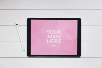 Top View Tablet Mockup on White Wooden Table