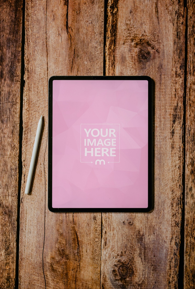 Top View of iPad Mockup on Wooden Floor for Minimal Design Display preview image