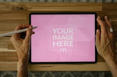 iPad Mockup with Stylus on Wooden Table for Creative UI Design