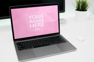Laptop Mockup on White Table in Living Room for Website Branding