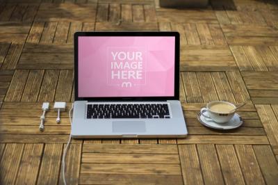 Laptop Mockup with Coffee Cup on Wooden Table