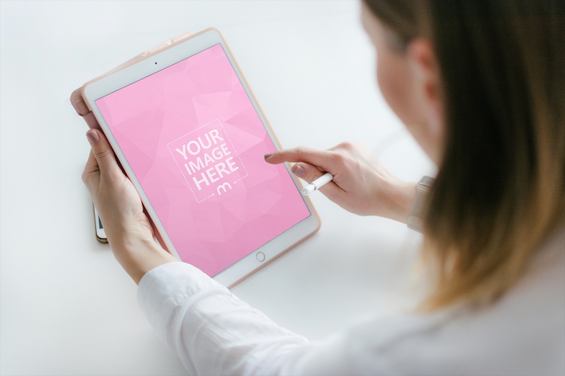 iPad Mockup Held by Woman in White Background preview image