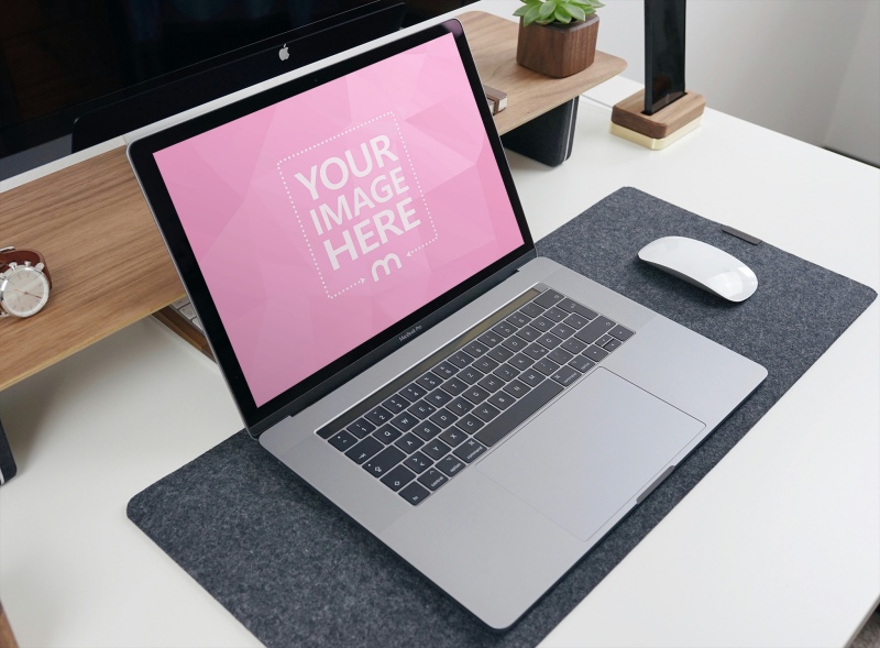 Laptop Mockup on Mouse Pad in Living Room for Website Display preview image