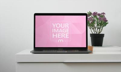 Laptop Mockup with Book and Vase on Table for Creative Branding
