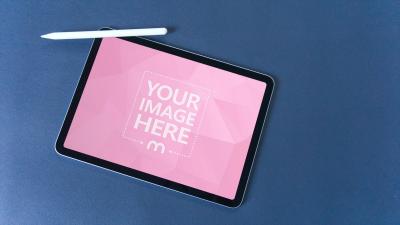 iPad Mockup on Blue Background with Stylus for Design Display