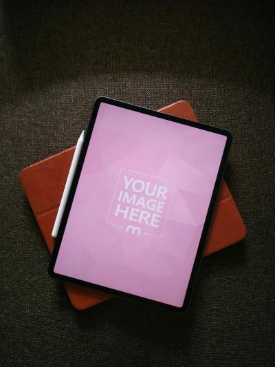 Top View iPad Mockup on Bag with Stylus for App Branding