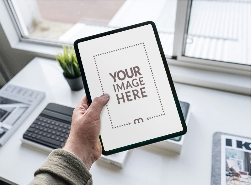 iPad Mockup in Hand at Office for Business Presentation preview image