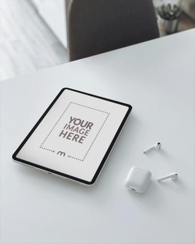 iPad Mockup on White Table with AirPods