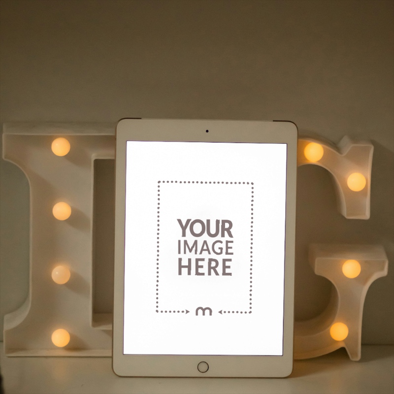 iPad Mockup with Christmas Lights for Holiday Promotion preview image