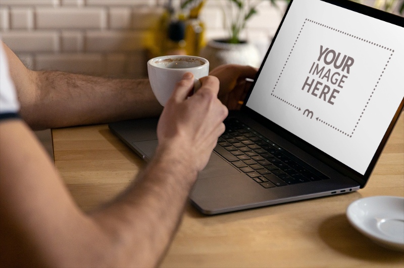 Laptop Mockup with Person Drinking Coffee preview image