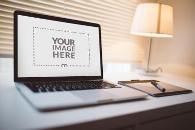 Laptop Screen Mockup in Home Office Setup for Productivity Ads