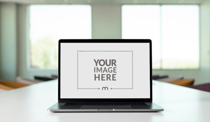 Laptop Screen Mockup on Office Conference Table for Team Projects preview image