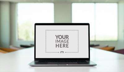 Laptop Screen Mockup on Office Conference Table for Team Projects