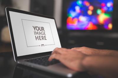 Laptop Screen Mockup with Person Typing for Work Branding