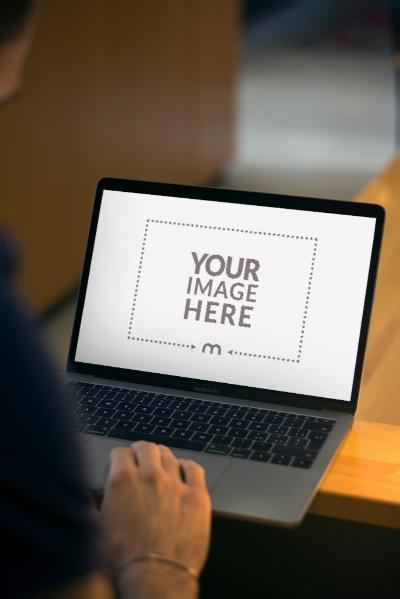 Laptop Screen Mockup with Person Working for Productivity Showcase
