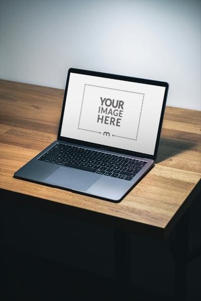 MacBook Mockup on Wooden Table for App Presentation