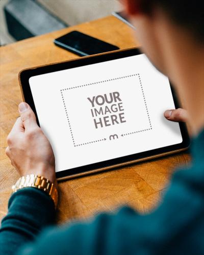 Tablet Mockup with Person Viewing Screen for Lifestyle Ads