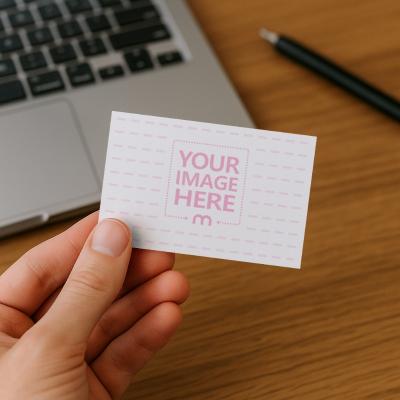 Business Card Mockup Held by Hand on Desk
