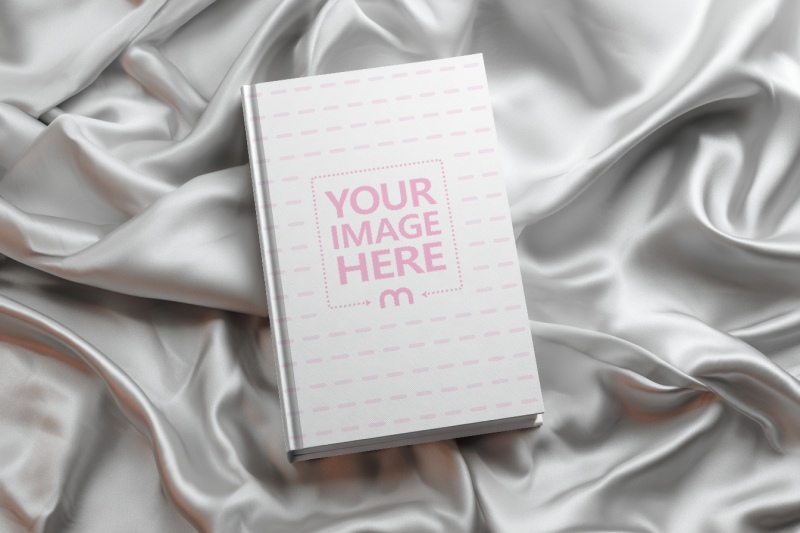 Book Cover Mockup on Crumpled Cloth for Elegant Presentation preview image