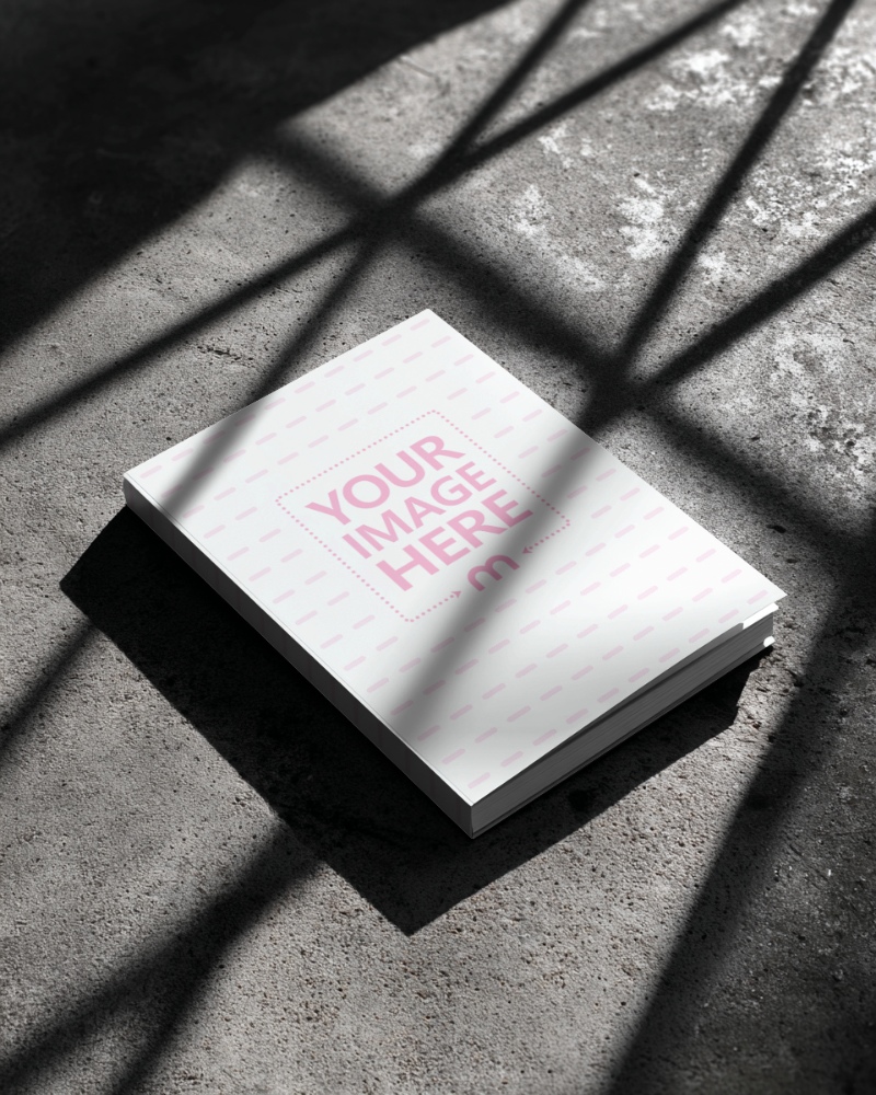 Book Cover Mockup on Concrete Floor with Shadows for Industrial Books preview image