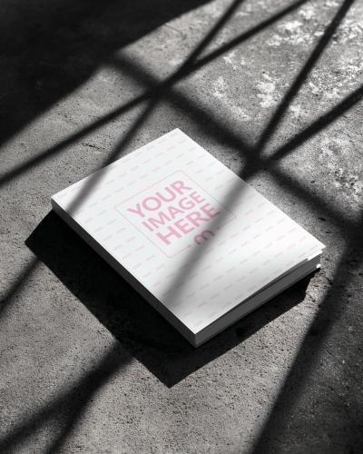 Book Cover Mockup on Concrete Floor with Shadows for Industrial Books