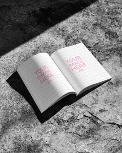 Open Book Page Mockup on Concrete Floor for Bright Editorial Display