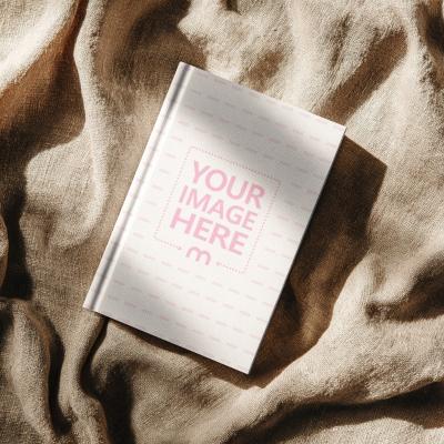 Book Cover Mockup on Brown Fabric for Rustic Cover Designs