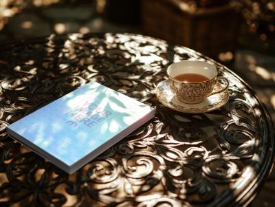 Book Cover Mockup on Wooden Table with Tea