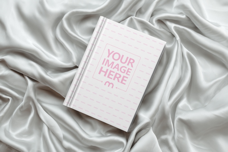 Book Cover Mockup on Crumpled Silver Cloth for Romantic Book Covers preview image