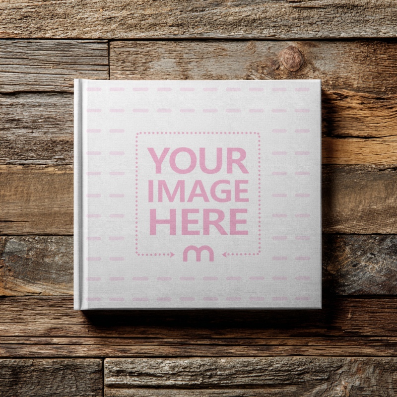 Top View of Square Book Cover Mockup on Wooden Floor preview image