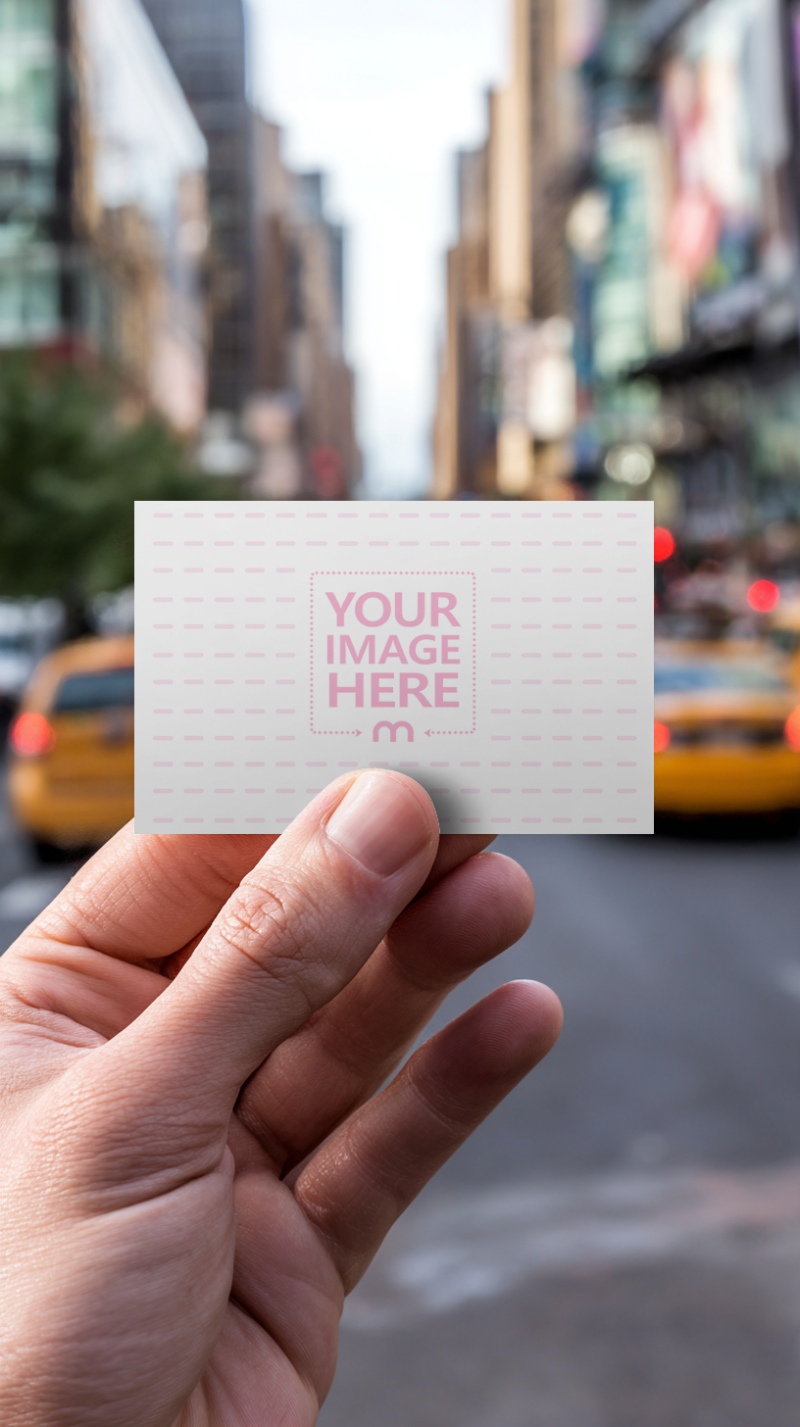 Business Card Mockup in Hand with City Background preview image