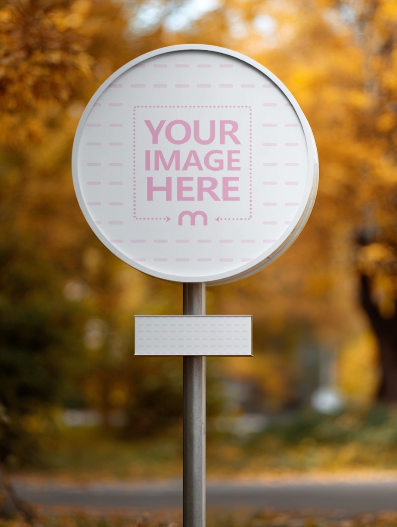 Round Sign Mockup on Roadside with Autumn Trees and Leaves preview image