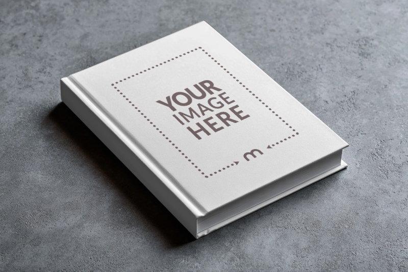 Angled View Book Cover Mockup on Concrete Floor preview image