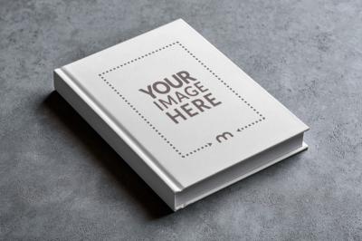Angled View Book Cover Mockup on Concrete Floor