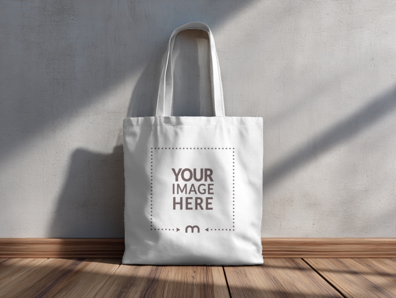 Angled View Tote Bag Mockup on Wooden Floor preview image