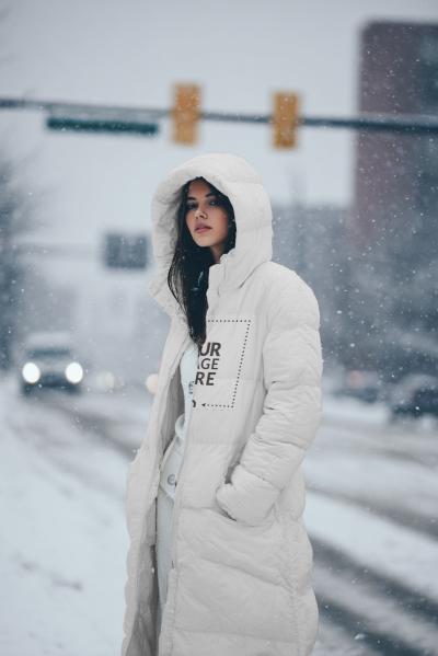 Parka Jacket Mockup on Woman Standing in Snowy Landscape