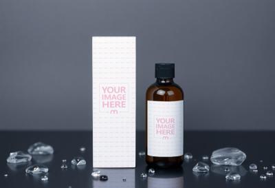 Amber Bottle and Box Label Mockup with Crystals on Dark Background