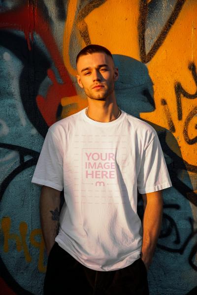 T-Shirt Mockup Generator on Man Against Graffiti Wall