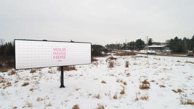 Billboard Mockup in Snowy Area for Seasonal Outdoor Advertising