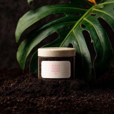 Bottle Label Mockup with Soil and Leaf for Eco-Friendly Products