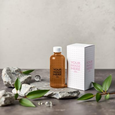 Oil Bottle and Box Mockup with Rocks on Brown Floor Background