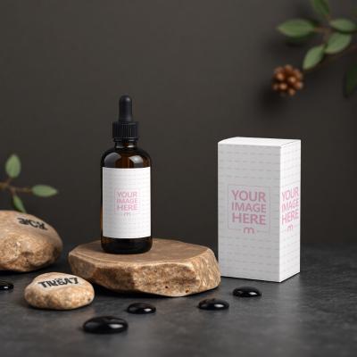 Bottle Label and Box Mockup on Rock with Dark Background