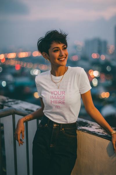 T-Shirt Mockup with Woman Leaning Against Wall with City Lights